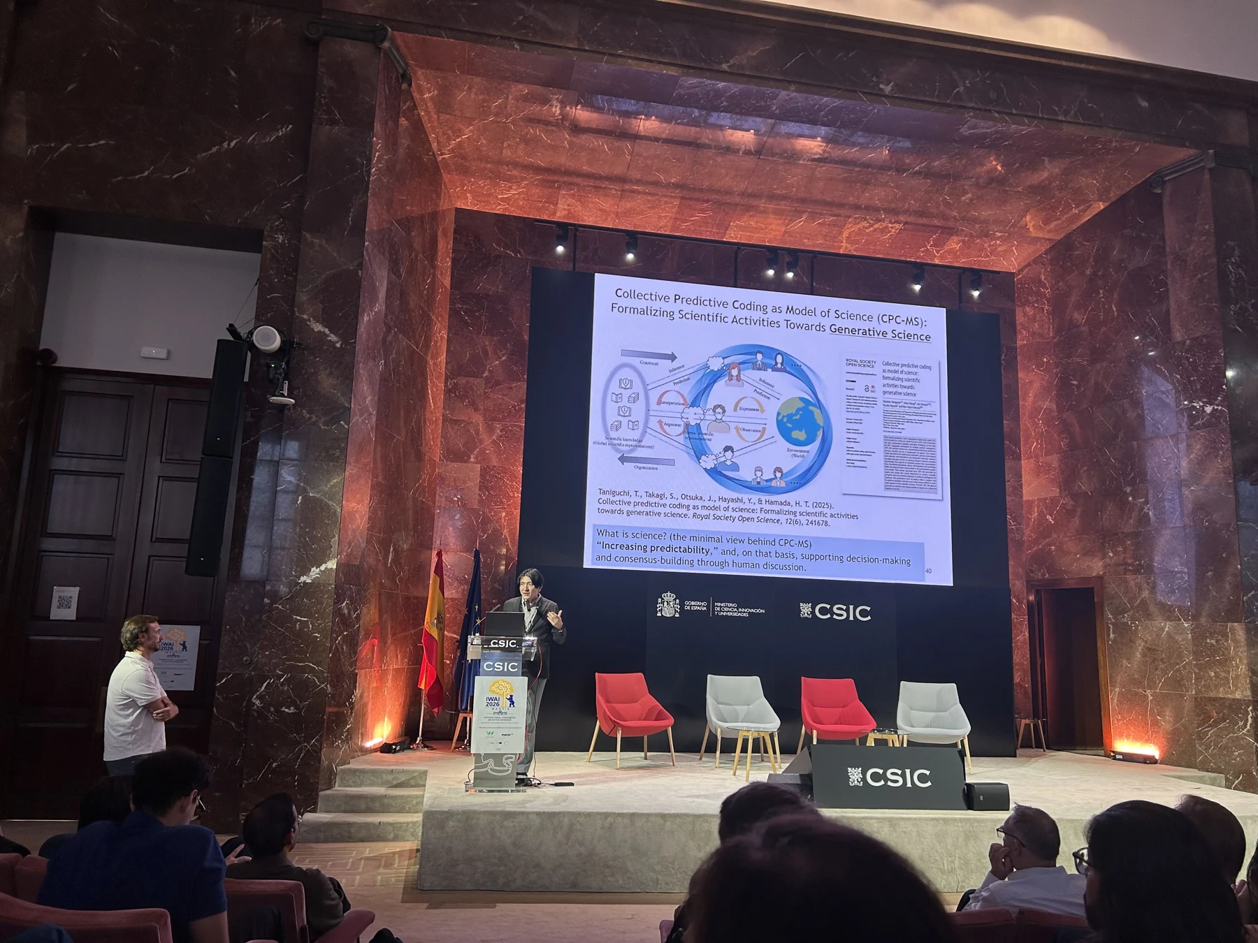 Tadahiro Taniguchi presenting CPC-MS at IWAI 2026 in Madrid